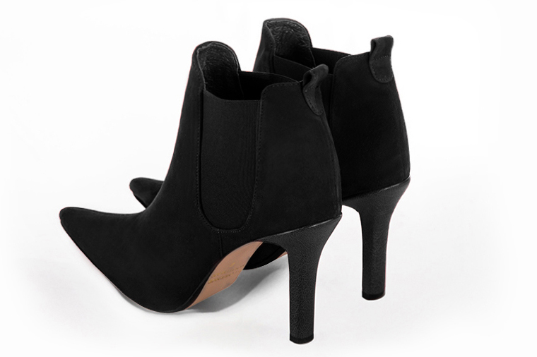 Matt black women's ankle boots, with elastics. Pointed toe. High slim heel. Rear view - Florence KOOIJMAN